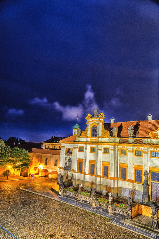 Loreta Church Prague White Baroque Photography! Loreta church Prague green rooftop white belfry walls red rooftop capturing Czech baroque historic landmark architecture bell tower cathedral monastery sanctuary.